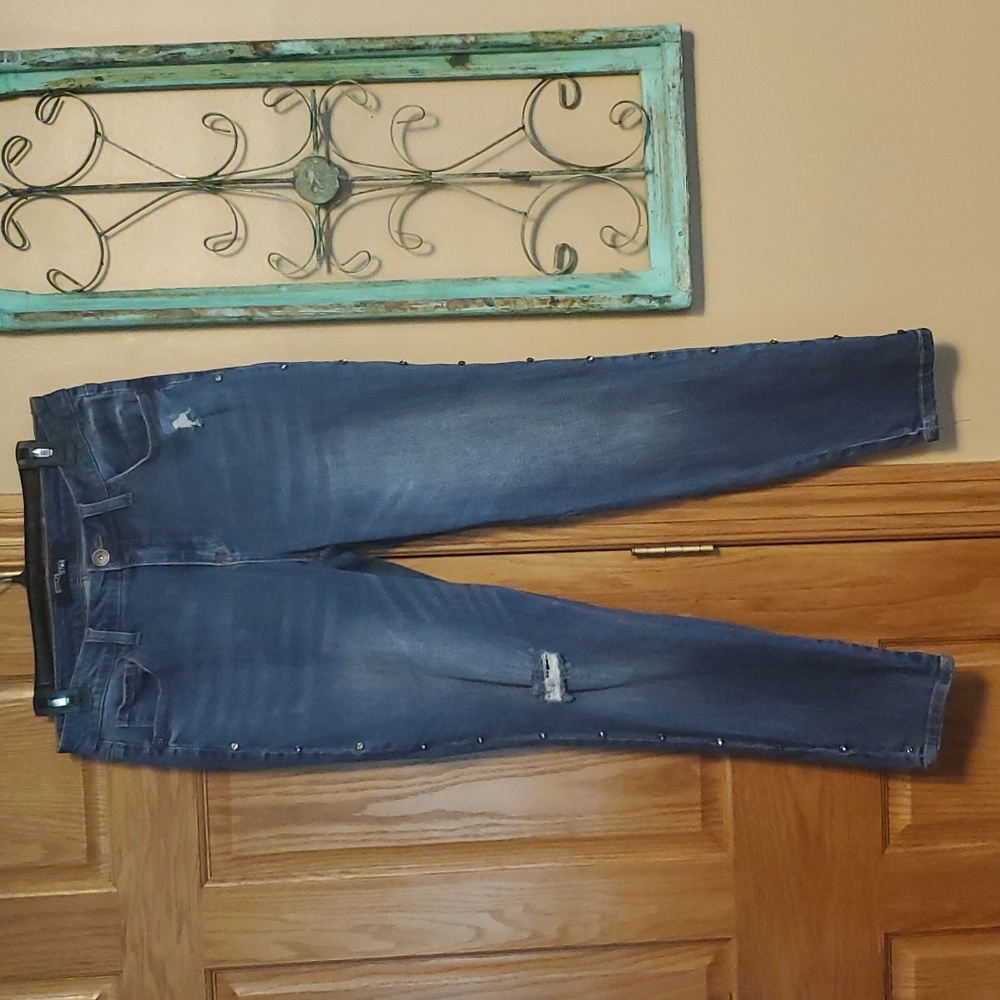 Ladies denim jeans with stretch, green riveted stones down outside of each leg